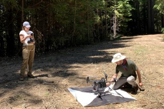 GEP students working with geospatial analysis equipment in the field
