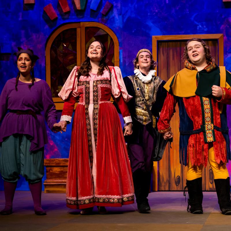 Actors on stage singing
