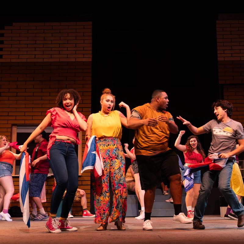 Actors on stage singing
