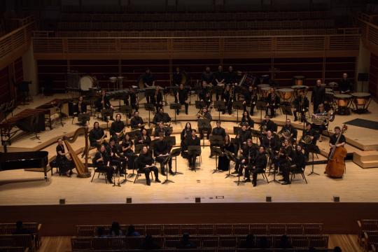 Student orchestra playing on the GMC stage