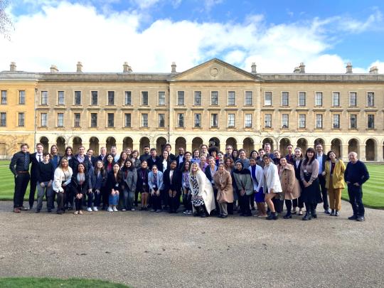 Participants of the March 2024 OCHR workshop in Oxford England posing on the Oxford University campus