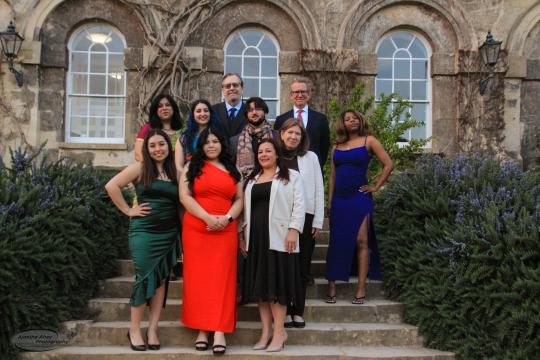 A small group of people in front of a building in Oxford, Enlgand